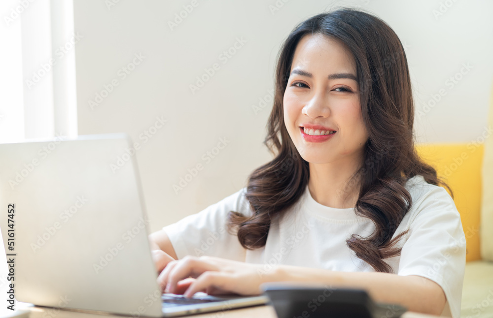 Young Asian woman working at home Young Asian woman working at home