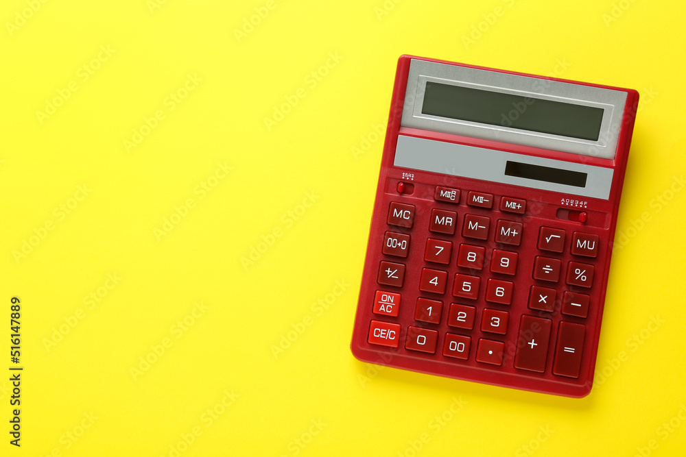 Red calculator on yellow background, top view. Space for text Red calculator on yellow background, top view. Space for text