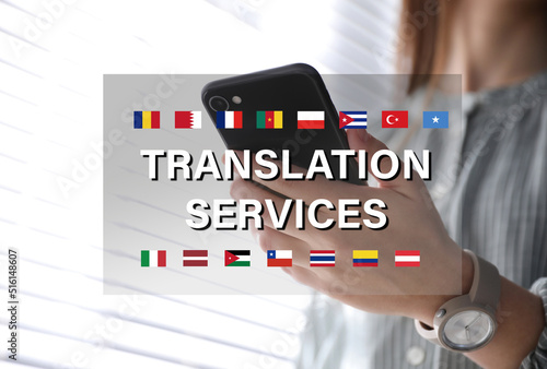 Translation services. Woman holding smartphone indoors, closeup