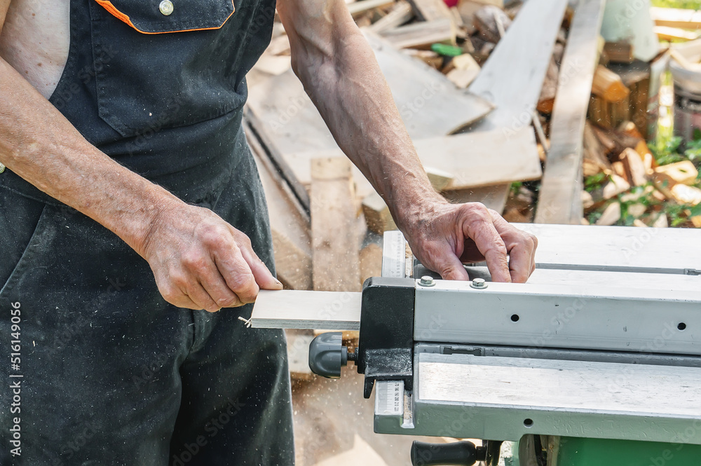 turner works on a lathe. The saw table. a man steals a tree with a milling machine. An experienced carpenter cuts a wooden board with a circular saw. Production of wood materials. Real life turner works on a lathe. The saw table. a man steals a tree with a milling machine. An experienced carpenter cuts a wooden board with a circular saw. Production of wood materials. Real life