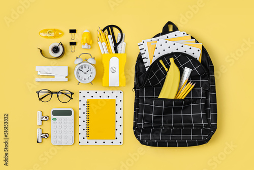 Black and white stationery on yellow background. School stationery supplies. Workplace organization. Concept back to school.. © igishevamaria