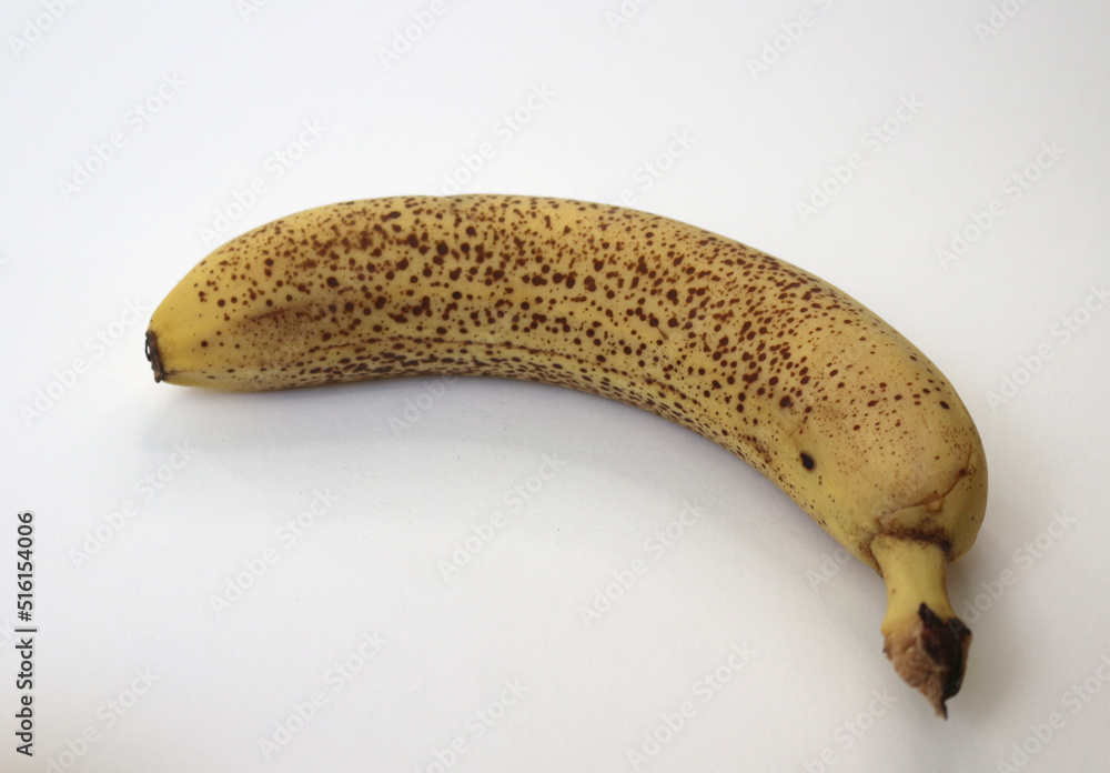Yellow banana dotted on white background