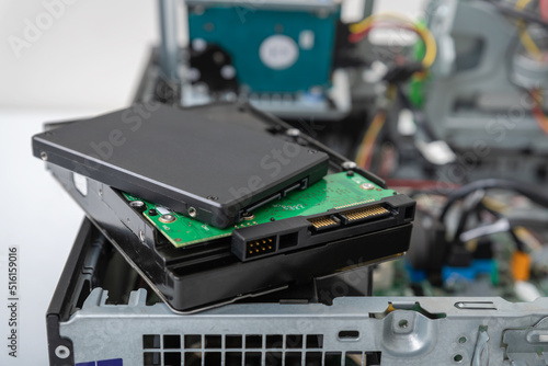 Closed-up view of SSD and spindle hard disks on top of business desktop PC