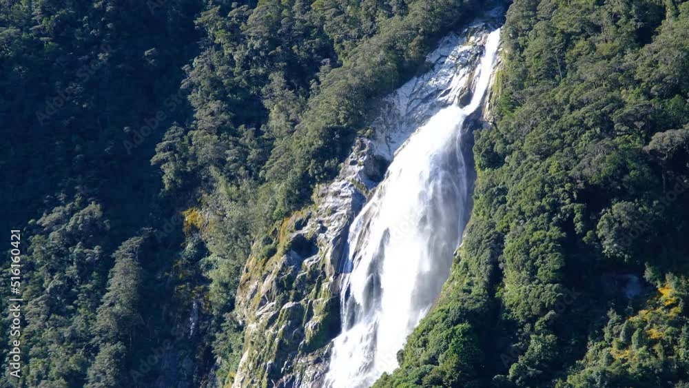 Waterfall in Milford Sound, New Zealand Waterfall in Milford Sound, New Zealand