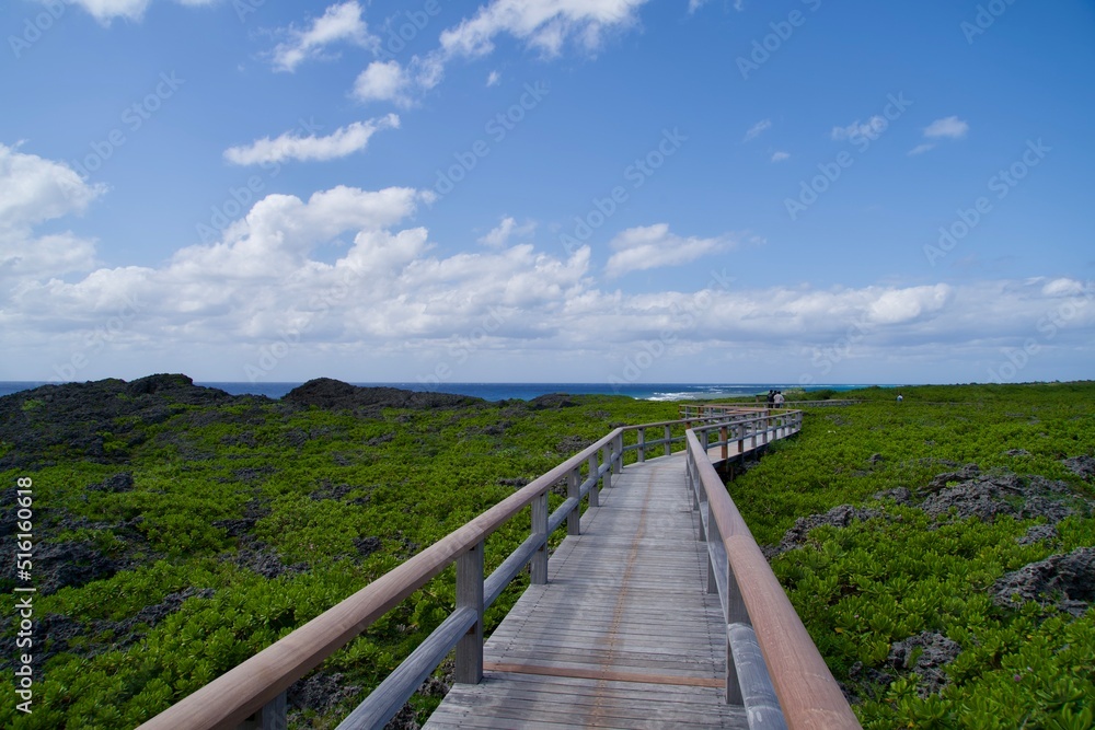 Wood deck road over rocks and natural scenery of Irabu Island
