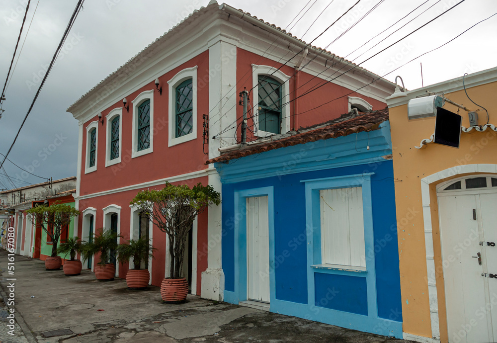 Cloudy sky. Old houses with bright and beautiful colors. City of Porto Seguro. Bahia.