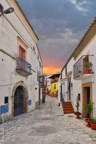 A narrow street between the old houses of Grottole  a village in the Basilicata region  Italy.