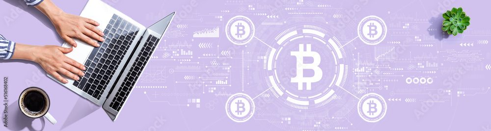 Bitcoin theme with person using a laptop computer Bitcoin theme with person using a laptop computer