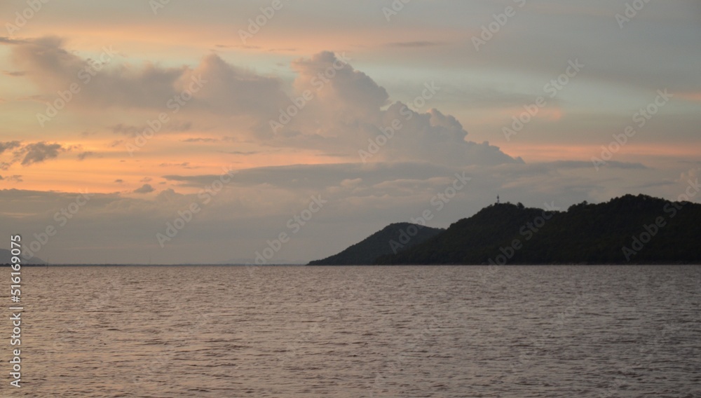 sea, mountains, the sky at dusk Orange light shines beautifully, concept, vacation, travel, vacation, weather, season