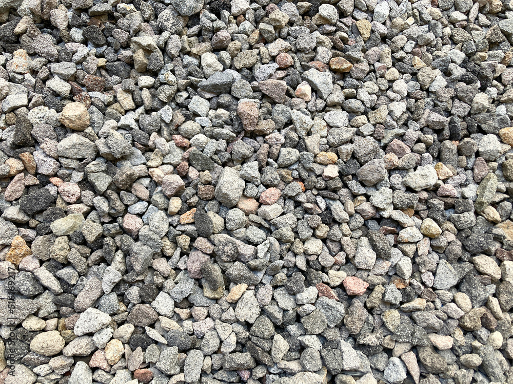 Abstract rock texture. Split stone preventing the growth of grass that can interfere with rainwater drainage. Abstract rock texture. Split stone preventing the growth of grass that can interfere with rainwater drainage.
