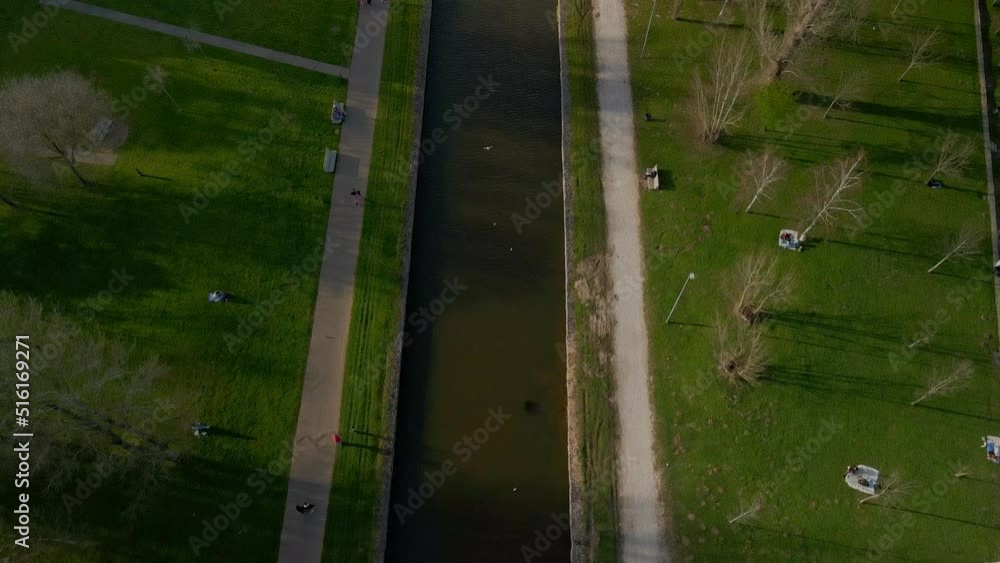 Revealing the water channel in the city park of Coimbra. Aerial view shot in 4K Revealing the water channel in the city park of Coimbra. Aerial view shot in 4K