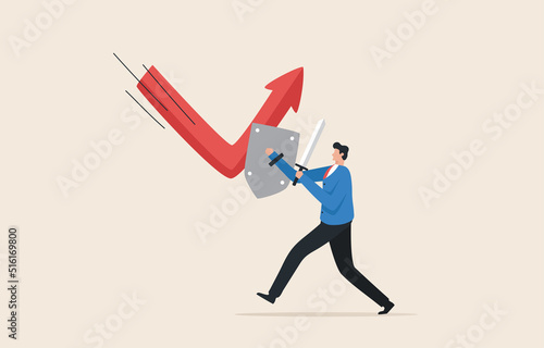 Business reversal from recession. Economic recovery. Stock market bounce back or reversal...Businessman holding a strong shield to recover the red arrow economic graph. photo