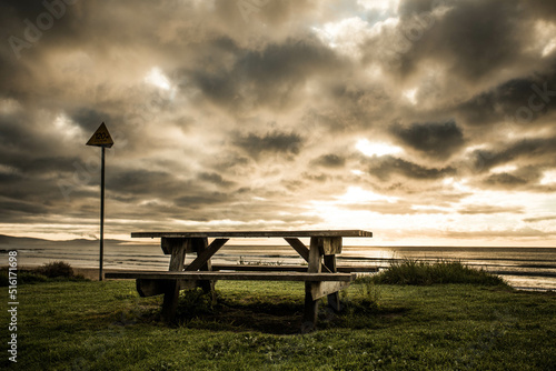 Table and bench seating at Lorne Beach in the morning, Victoria, Australia