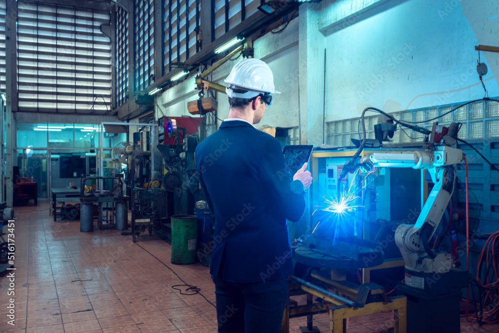 senior engineer In progress to control the robotic arm to do the welding of the workpiece. with resolution and high accuracy requirements by tablet to obtain workpieces used in the automotive industry senior engineer In progress to control the robotic arm to do the welding of the workpiece. with resolution and high accuracy requirements by tablet to obtain workpieces used in the automotive industry