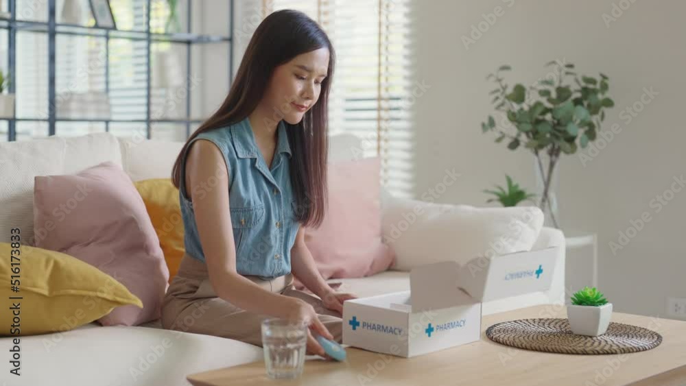 Young girl sit on sofa couch open mail box from drug store at home table. Asia adult people unbox first aid kit blood sugar test tools buy order from online clinic self cure supply chain care service. Young girl sit on sofa couch open mail box from drug store at home table. Asia adult people unbox first aid kit blood sugar test tools buy order from online clinic self cure supply chain care service.