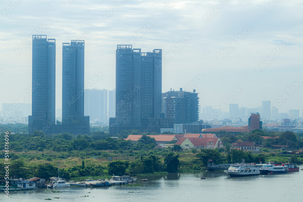 Fototapeta premium Saigon, Vietnam - Jun 21, 2021 - Impression landscape of Ho Chi Minh city at night, Saigon river flows through the city