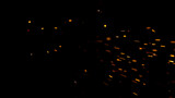 Flying Fire Sparkles. Detail shot, Low Depth of Focus. Filmed on High Speed Cinema Camera, 1000 fps.