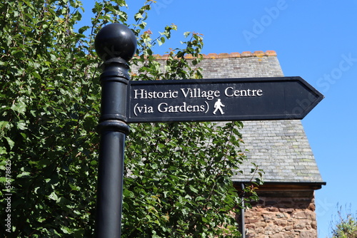 A signpost in Dunster, Somerset pointing to the historic village centre