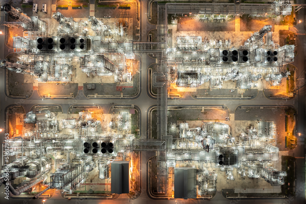 Aerial top view of night oil refinery and factory Petrochemical plant photograph from drone