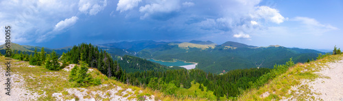Outstanding view of Ialomita Valley and Bucegi Mountains, during a storm,  from Podu cu Florile, Bolboci lake, Padina Pestera Resort, Dambovita County, Romania photo