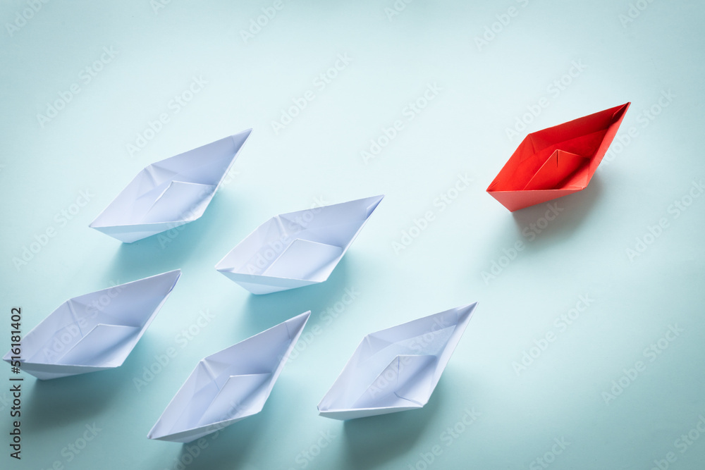 success leadership concept, red leader, white boats following the leader, development strategy planning, creative business concept success leadership concept, red leader, white boats following the leader, development strategy planning, creative business concept