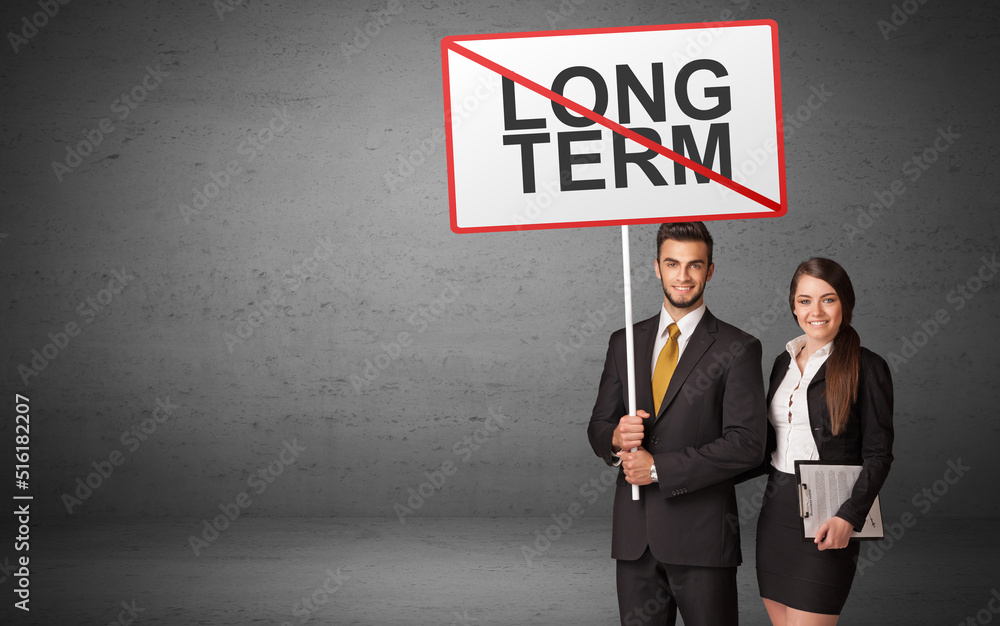 business person holding a traffic sign business person holding a traffic sign
