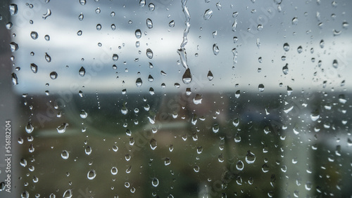 Raindrops on a window glass close-up