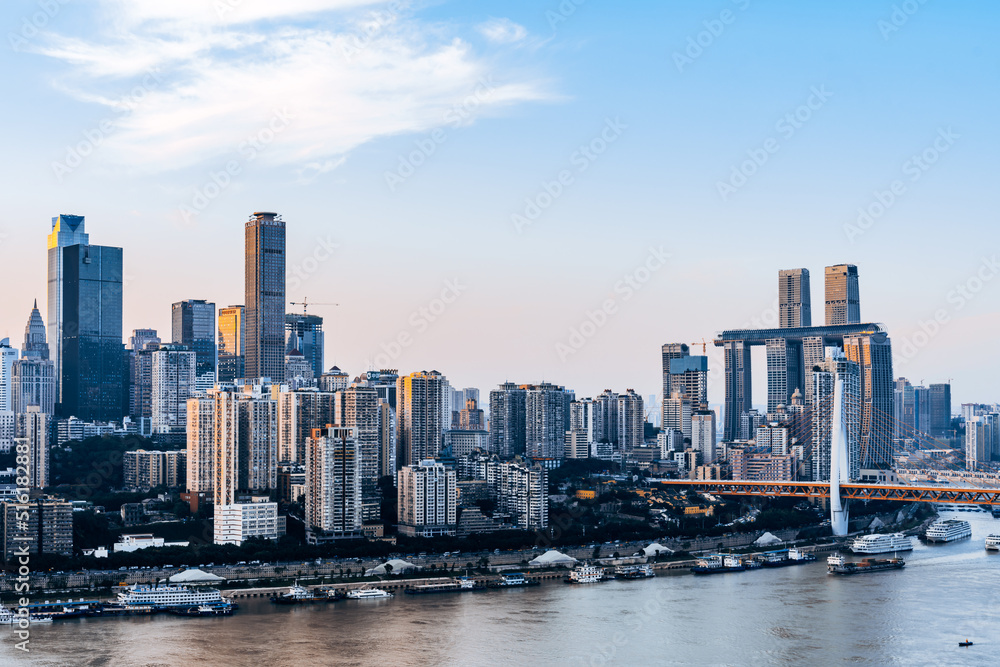 High angle view of tall buildings and Dongshuimen bridge in Chongqing city, China on sunny day