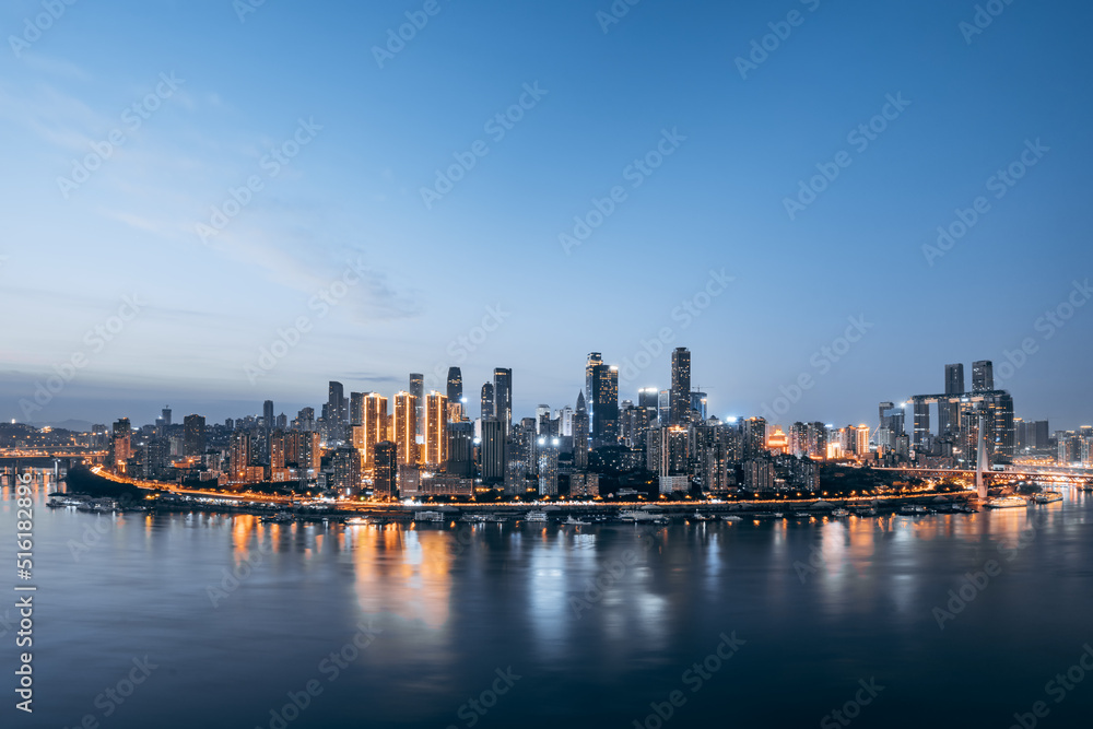 High-angle night scenery of tall buildings along the Yangtze River in Chongqing, China
