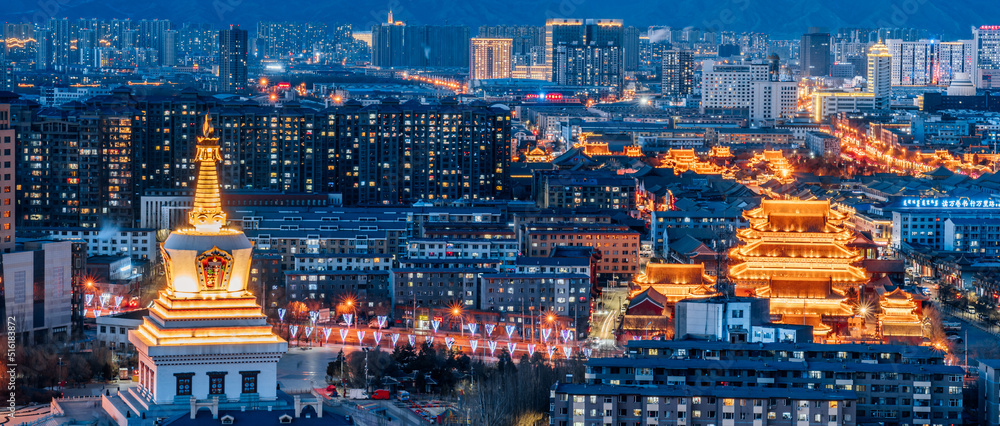 Night view of the city skyline night view with buildings of Baoerhan Pagoda, Guanyin Temple and Dazhao Temple in Hohhot, Inner Mongolia