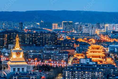 Night view of the city skyline night view with buildings of Baoerhan Pagoda, Guanyin Temple and Dazhao Temple in Hohhot, Inner Mongolia