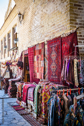 uzbek carpets on the street, bazaar, Buchara, Buxoro, Bukhara, Uzbekistan, silk road, central asia © Andrea Aigner