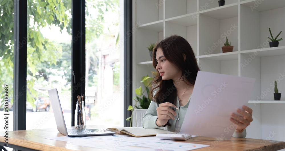 Portrait of smiling beautiful business asian woman with working in modern office desk using computer, Business people employee freelance online marketing e-commerce telemarketing concept. Portrait of smiling beautiful business asian woman with working in modern office desk using computer, Business people employee freelance online marketing e-commerce telemarketing concept.
