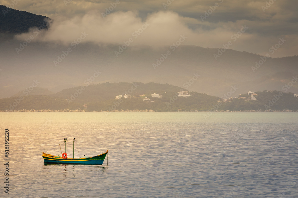 Bay with fishermen boat in Jurere beach at sunset Florianopolis, Brazil