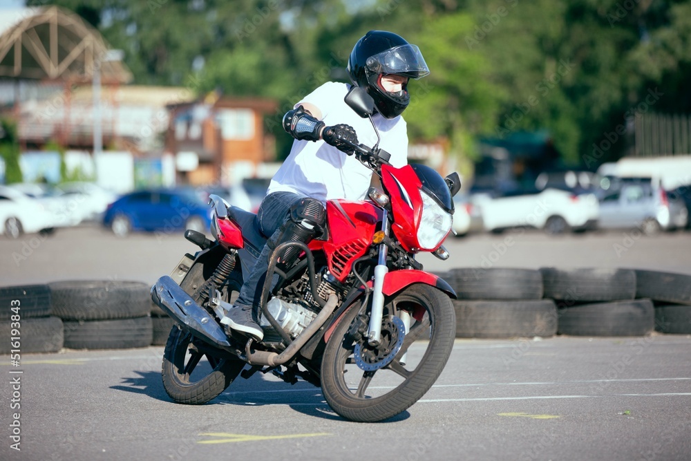 Moto school track driving. A biker on a motorcycle.
