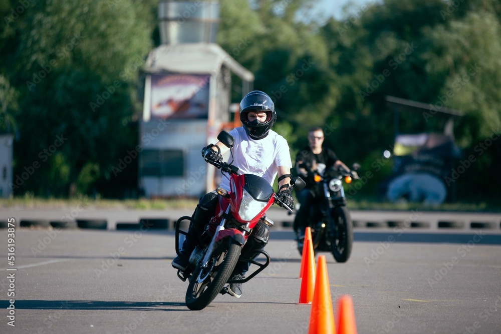 Moto school track driving. A biker on a motorcycle.
