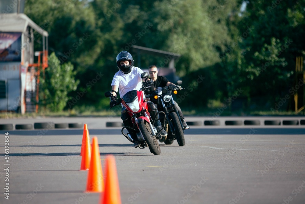 Moto school track driving. A biker on a motorcycle.
