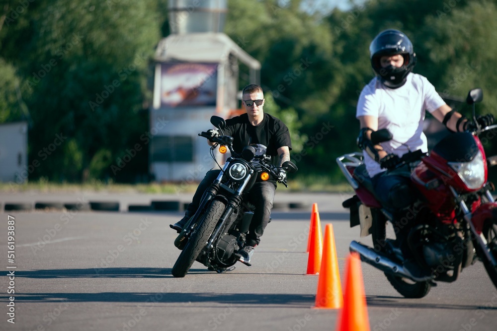 Moto school track driving. A biker on a motorcycle.
