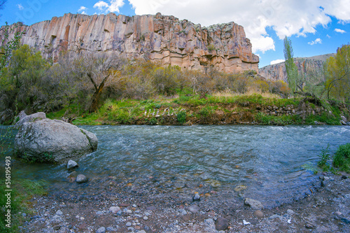 The Ihlara Valley with river on it from below or Peristrema Valley of Cappadocia in Guzelyurt, Aksaray, Turkey. photo