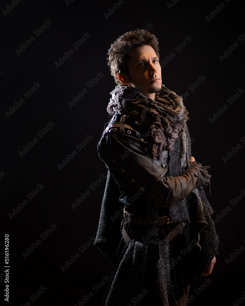 A guy in a steampunk or post-apocalyptic image, portrait on a black background