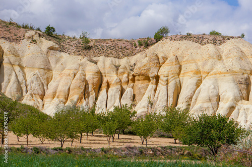 Spectecular landscape of Mustafapasa village on summer time with mountains, hills, trees and nature of Cappadocia, Urgup, Nevsehir, Turkey. photo