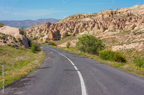 Road trip in Cappadocia, with a view of fairy chimneys, hills, natural landmarks. Nevsehir, Turkey.