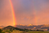 View of a double rainbow at sunset against a backdrop of mountains in the town of Clarens, South Africa, near the Golden Gate Highlands National Park