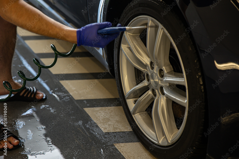 Fototapeta premium Automobile Wash Cleaness Hose. Carwash Service. Business Care. Garage Concept