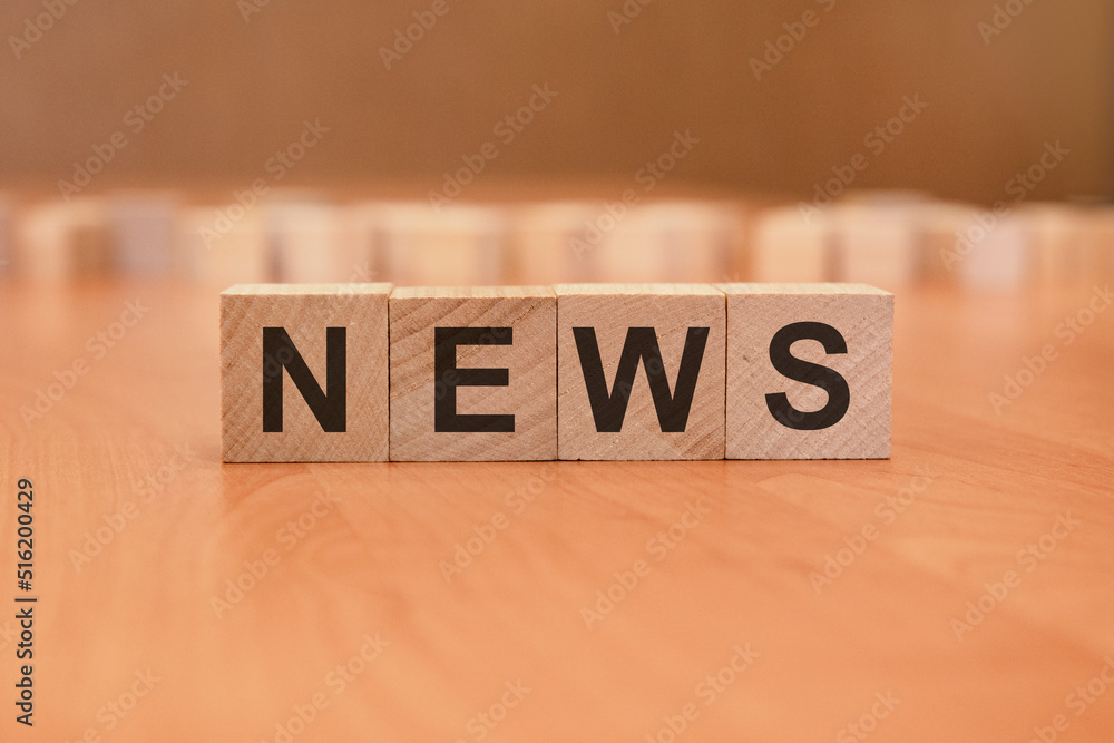 wooden cubes with the inscription - NEWS, brown background wooden cubes with the inscription - NEWS, brown background