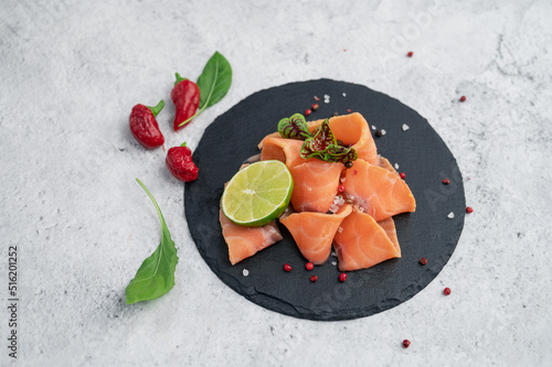 Fresh salmon slices with pe...