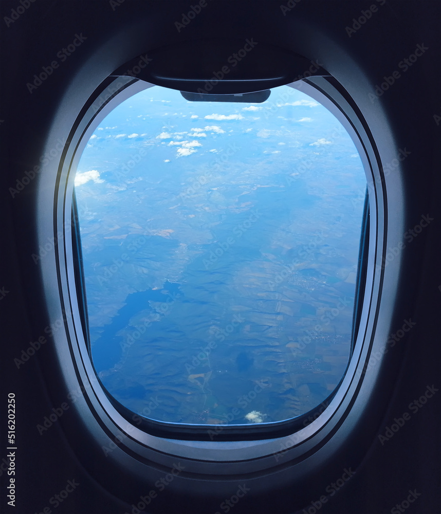 Looking through the airliner window out. Beautiful scenic overhead airplane view of African coast. Flying over Africa