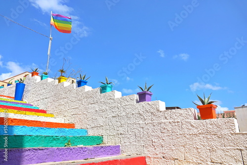 Fototapeta Naklejka Na Ścianę i Meble -  Colored staircase that leads from the town to the old port. Lampedusa, Italy  - August 2019
