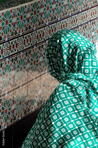 Mouride muslim praying in front of Sheikh Ahmadou Bamba's tomb photo