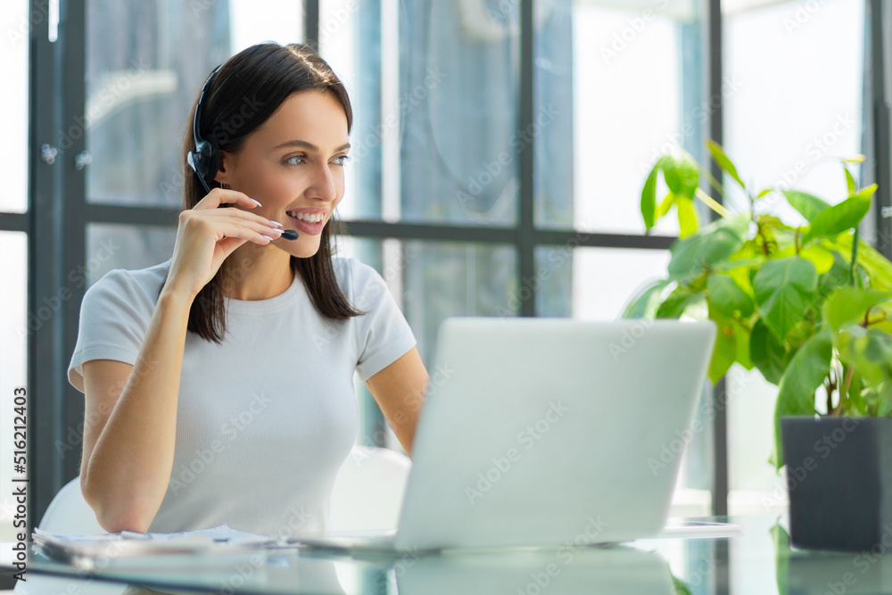 Female customer support operator with headset and smiling Female customer support operator with headset and smiling